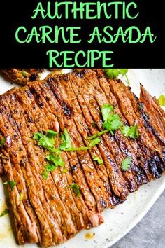 grilled steak on a white plate with green garnish and the words authentic carne asada recipe