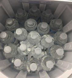 there are many empty water bottles in the bucket