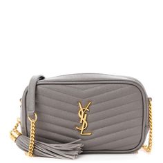 This is an authentic SAINT LAURENT Grain De Poudre Matelasse Monogram Mini Lou Camera Bag in Fog. This chic shoulder bag is crafted of beautiful textured calfskin leather in light grey. It features a gold chain shoulder strap with a leather shoulder pad, a rear pocket, and gold hardware. The top tassel zipper opens to a compact black leather interior with card slots. Leather Interior, Shoulder Pads, Gold Hardware, Gold Chain, Gold Chains, Camera Bag, Card Slots, Calf Skin, Slots