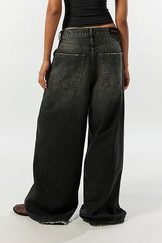 Statement BDG jeans in a column silhouette. Designed with an ultra-wide leg in a low-rise that sits at the hips and raw hems that skim the floor for an edgier vibe. Exclusively at Urban Outfitters. Features BDG Anika ultra-wide leg column jeans Low rise baggy jeans Lightweight soft denim Low rise waist 5 pocket styling Full length Raw hems UO exclusive Content + Care 42% Cotton, 20% recycled cotton, 38% Tencel Machine wash Imported Size + Fit Low rise Ultra-wide column leg Full length Model in B Low Low Rise Jeans, Dream Clothes Pants, Extremely Baggy Jeans, Lowrise Baggy Jeans, Girls Skater Style, Baggy Black Jeans Outfit, Ultra Baggy Jeans, Low Rise Black Pants, Black Jeans Baggy