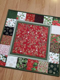 This beautiful quilted Christmas table topper / wall hanging will bring the warmth and glow of the holiday season with poinsettias, holly leaves, berries, snowflakes, candy canes and swirling designs in traditional Christmas colors with a touch of gold metallic accent.  MEASUREMENTS: approximately 18.5" x 18.5" The table topper is made with premium 100% cotton fabric from the Merry Manor collection by Moda Fabrics. The central panel, Poinsettia Waltz Metallic Red, is cross-hatch quilted and framed by two thin borders of Olive and Sage Linen Texture fabrics by Makower, then a wide border of different squares from the Merry Manor collection, all of them straight line quilted in coordinating threads along the borders. The backing fabric is red and sandwiched between the front and back is a la Topper Floral, Straight Line Quilting, Christmas Wall Hangings