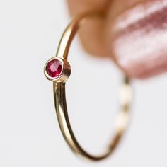 Ruby Ring, Tiny Ruby Ring, Rose Gold Ring, Bezel Ring, Engagement Ring, Tiny Ring, July Birthstone Ring, Solitaire Ruby Ring, Stacking Ring, Small Ruby Ring, Dainty Ruby Ring A modern and timeless 14K gold ring with a natural ruby gemstone. A perfect gold ring for women, stacking and minimalist that adds glam to every outfit. The best gift for her. 100% handcrafted with love! ● Metal: 14K solid gold, 14K white gold or 14K rose gold ● Gemstone: Ruby ● Stone Diameter: 2mm R I N G ∙ S I Z I N G For Dainty Ruby Ring, 14k Gold Ruby Ring, Gold Ring For Women, July Birthstone Ring, Ruby Ring Gold, Gemstone Ring Silver, Bezel Engagement Ring, Tiny Rings, Ring Bezel