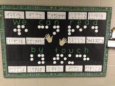 a bulletin board with hands and numbers on it that says we can read by touch