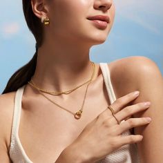 Our 14K Gold-Filled Interlocking necklace is a beautiful sentiment between loved ones, best friends, or mother and child. The charm pendant adds an elegant touch, and the intricate details will make you feel like your look is complete! - 14k gold-filled- Chain width: 2.5 mm.- Small circle 9mm, Large circle: 12.6mm- Chain length: 16" + 2" extension- Waterproof, Tarnish resistant & Hypoallergenic Feminine Gold Round Pendant Jewelry, Gold Plated Clavicle Chain For Mother's Day, Gold Heart Pendant Jewelry For Feminine Style, Gold Heart Pendant Feminine Jewelry, Feminine Gold Pendant Charm Necklaces, Feminine Gold Pendant Charm Necklace, Feminine Gold Heart Pendant Jewelry, Feminine Gold Pendant Jewelry, Feminine Gold Charm Necklace For Everyday