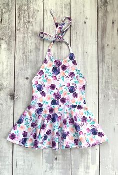 Girls purple peach floral halter summer dress Please allow 3-5 business days for your item to be made and shipped. All items are shipped by USPS First class mail. Each item is handmade in a smoke free, pet free home. If you need something custom made, please send me a message. Cute Printed Summer Sundress, Playful Floral Sundress For Summer, Playful Floral Print Sundress For Summer, Fitted Pink Halter Dress With Tie Back, Pink Fitted Halter Dress With Tie Back, Fitted White Halter Dress With Floral Print, White Fitted Halter Dress With Floral Print, Cute Printed Sundress For The Beach, Pink Spring Halter Dress For The Beach