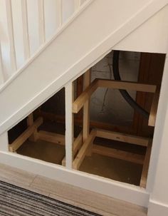 the bottom half of a stair case under stairs