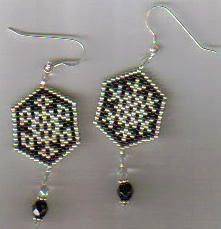 a pair of black and white beaded earrings