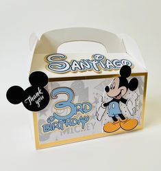 a cardboard box that has a mickey mouse on it