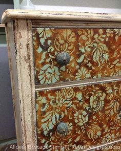 an old dresser has been painted with floral designs