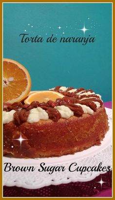 there is a cake with nuts and oranges on it