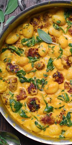 Creamy Pumpkin Gnocchi with Spinach and Sausage in a stainless steel pan. Creamy Pumpkin Gnocchi With Spinach And Sausage, Creamy Pumpkin And Sausage Gnocchi, Creamy Pumpkin Gnocchi Recipes, Fall Recipes Gnocchi, Sweet Italian Sausage Gnocchi Recipes, Pumpkin Gnocchi With Sausage, Fall Soups Gnocchi, Pumpkin Puree Gnocchi, Pumpkin Spinach Gnocchi