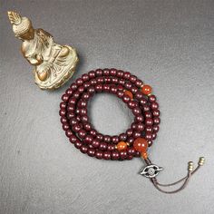 ❤This mala is made by Tibetan craftsmen and come from Hepo Town, Baiyu County,Tibet, the birthplace of the famous Tibetan handicrafts.It's composed of 108 pcs 9mm lotus seed beads,with agate spacer beads,and agate bead counters,diameter 0.35",circumference 35".❤Details:Mala'perimeter is 88cm,35 inches.108 lutus seed beads approximately 9mm / 0.35 inch.1 × agate main bead,diameter 12mm × 10mm / 0.47 × 0.4 inch.2 × agate spacer beads diameter 10mm / 0.4 inch.1 × agate guru bead,22mm × 13mm / 0.87 Traditional Jewelry For Meditation With 8mm Beads, Traditional 8mm Beads Jewelry For Meditation, Traditional Jewelry With 8mm Beads For Meditation, Handmade Spiritual Beaded Bracelets For Meditation, Traditional Wooden Beaded Bracelets For Meditation, Traditional Handmade Beaded Bracelets For Meditation, Traditional Wooden Beads Mala As Gift, Traditional Beaded Bracelets For Meditation With 108 Beads, Holistic Beads For Festivals And Gifts