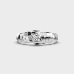 a white gold ring with a diamond in the center and vertical stripes on the band