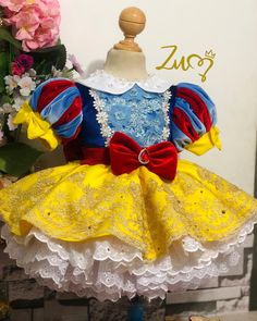 a dress made to look like snow white and the princess from beauty and the beast