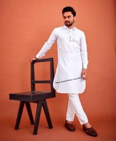 HANDMADEKURTASHOP  Description Man kurta for Man Give yourself a best ethnic look by wearing this Top and bottom Set. Made of rich cotton silk blend fabric this regular-fit set comprises a full-sleeved Indian kurta pajama This outfit with mojris will look apart on special occasions. material 100%Cotton Color : white color, Kurta Length : 40 inches Pathani kurta pajama set Shirt Chest is measurement for shirt (not body) As per standard, for best loose fitting 6 inches gap should be there between actual chest size and shirt chest size Size chart is below Men's Sizes Actual Body Chest - Ready Shirt Chest i Add 6" Inches Lose Fitting Fabric Armhole To Armhole. XS - 30" Inches 36" Inches S - 34" Inches 40" Inches M - 36" Inche 42" Inches L - 40" Inches 46" Inches XL - 44" Inches 50" Inches 2XL Unstitched Cotton Churidar, Naqshi Cotton Straight Kurta, Cotton Sherwani With Naqshi In Straight Kurta Style, Eid Cotton Kurta With Naqshi Embroidery, White Cotton Kurta With Dabka, White Cotton Kurta With Dabka Embroidery, Kurta Pajama Pathani, Wedding Kurta, Kurta For Men