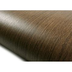 a close up view of the wood grained surface on a roll of vinyl material