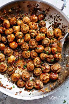 a pan filled with meatballs covered in sauce