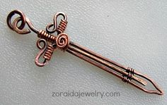 an antique style key is shown on a white surface