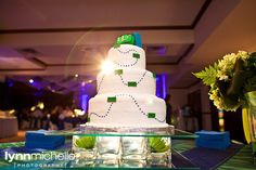 a wedding cake sitting on top of a table