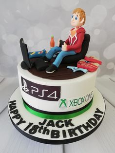 a birthday cake with a man sitting on top of it