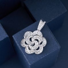 Introducing our Designer Luxury Crystal Camellia Flower Pendant, an elegant and timeless jewelry piece made with high-quality 925 silver. This exquisite pendant features a beautifully crafted camellia flower design, adorned with sparkling crystals that catch the light for a truly captivating effect.Inspired by the delicate beauty of camellia flowers, this pendant offers a sophisticated and refined touch to any outfit. The combination of luxurious crystals and premium 925 silver ensures a durable Luxury Silver Flower Pendant Jewelry, Exquisite Luxury Jewelry With Flower Pendant, Luxury Silver Flower Jewelry, Luxury Delicate Flower Pendant Jewelry, Luxury Delicate Jewelry With Flower Pendant, Camellia Flowers, Camellia Flower, Delicate Beauty, Timeless Jewelry