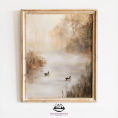 two ducks floating on top of a lake in front of a wall mounted art piece