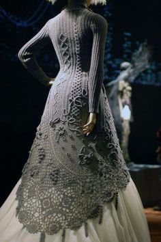 a woman in a dress made out of crochet