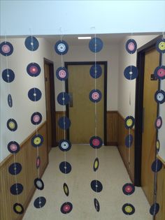 the hallway is decorated with paper discs and streamers