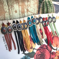 "Deer skin leather tassels with antique silver southwest concho. Drop or Hook backs. Approximately 5\"- 6\" long Concho is 1\" wide." Western Upcycle, American Outfits, Leather Tassel Earrings, Southern Jewelry, Tassels Handmade, Rustic Rose, Denim Earrings, Western Crafts, Diy Leather Earrings