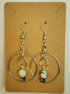 The charming dangle hoop pair shows off a sense of style mixed with the fun of swirled color. Gift Hoop Earrings With Dangling Beads, Green Bead, Statement Earrings, Jewelry Earrings Dangle, Dangle Drop Earrings, Dangle Earrings, Sense, Jewelry Earrings, Drop Earrings