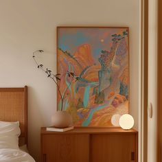 a bedroom with a painting on the wall next to a night stand and nightstands