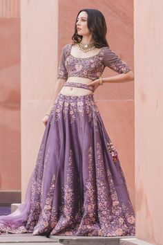 Deep mauve lehenga with attached cancan, highlighted with intricate floral embroidery and sequin embellishments. Comes with cutwork hemline padded blouse, organza dupatta and belt.
Component: 4
Embroidered
Neckline: Round
Sleeve Length: Elbow
Fabric: Lehenga and Blouse: Dupion Silk; Dupatta: Organza
Color: Purple
Resham, gota, dabka, crystals and sequin embroidery
Embroidered blouse with cutwork hemline
Tie-up at the back with latkans
Embroidered dupatta and belt - Aza Fashions Designer Lavender Sharara With Sheer Dupatta, Lavender Sharara With Sheer Dupatta For Designer Wear, Lavender Lehenga For Eid Party, Purple Art Silk Sets With Intricate Embroidery, Purple Dola Silk Sets For Designer Wear, Elegant Lavender Sharara With Zari Work, Lavender Sharara With Resham Embroidery For Diwali, Elegant Lavender Sharara For Wedding, Festive Purple Sets With Intricate Embroidery