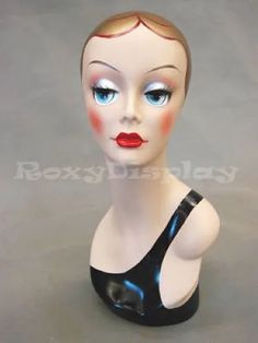 a mannequin head with blue eyes and red lips