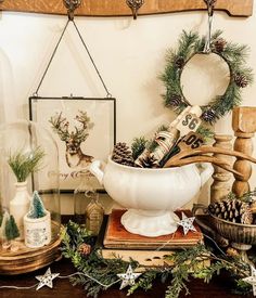 a table topped with lots of christmas decorations and decorating items on top of each other