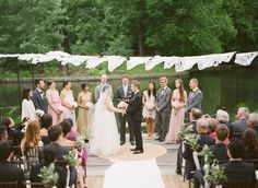 a couple getting married in front of an outdoor ceremony