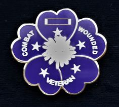 a purple flower with white stars on it and the words, corona y wounded veteran