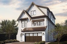 a two story white house with brown garage doors