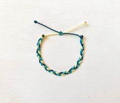 This fun bracelet is waterproof and great for anyone who is often doing outdoor activities. It would make a nice gift. Stack it with other bracelets, or wear it by itself! It is perfect for everyday wear! ∙ ∙ ∙ ∙ ∙ ∙ ∙ ∙ ∙ ∙ ∙ ∙ ◆ PLEASE NOTE ◆ When you first receive this bracelet it may be slightly sticky, which may make it more difficult to adjust. The stickiness does not last. After a day or two of wearing the stickiness will fade and it will be much easier to adjust. It will still be waterpr Green Nylon Cord Bracelets For The Beach, Green Nylon Cord Beach Bracelets, Casual Yellow Beaded Bracelets With Sliding Knot, Casual Yellow Beaded Bracelet With Sliding Knot, Casual Adjustable Yellow Braided Bracelets, Resizable Yellow Friendship Bracelets, Yellow Adjustable Friendship Bracelets For Beach, Adjustable Cord Yellow Bracelet For Beach, Resizable Yellow Friendship Bracelets For The Beach