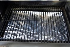 the grill is covered with silver foil