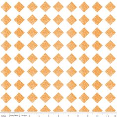 an orange and white checkered pattern on a white background with a ruler in the foreground