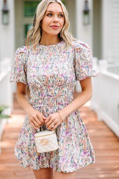 Look pretty as a petal in this Pinkin' Wild Flowers Ivory White Floral Dress! With ditsy floral detail, flattering lines, and cute puff sleeves, this dress will make you feel like a bloomin' beauty. Plus, its open back is sure to catch some admiring glances. This dress features a floral print, short bubble sleeves, a round neckline, smocked waist, and an open back detail.  Material has no amount of stretch.Cam is wearing the small. White Floral Dress, Ditsy Floral