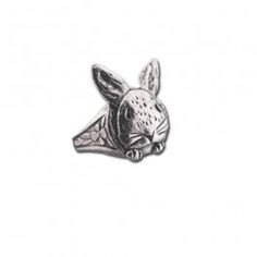 a metal pin with a rabbit head on it's face and the word bunny written in