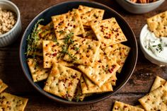 crackers and dips on a wooden table