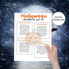 a hand holding up a halloween menu with the words halloween written on it in front of a snowy background