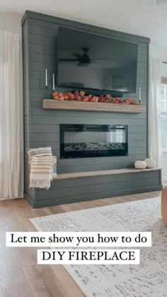 a living room with a couch, fireplace and tv on the wall in it's corner