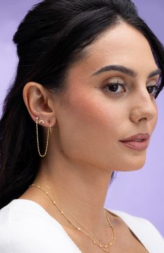 Sparkling diamonds highlight these handcrafted ball-chain earrings that drape from the front to the back of your lobes in glowing 18-karat gold. 1 3/4" drop; 1/8" width Total diamond weight: 0.065ct. Color: G Clarity: VS 18k gold/diamond Imported >Diamond Guide Certified member of the Responsible Jewellery Council (RJC), which sets standards for supply chain integrity and sustainability throughout the global jewelry and watch industries Elegant Earrings With Satellite Chain As Gift, Elegant Earrings With Satellite Chain For Gift, Yellow Gold Jewelry With Satellite Chain Dangle, Elegant Gold Ear Climbers With Adjustable Chain, Elegant Gold-plated Ball Chain Jewelry, Elegant Gold Plated Ball Chain Jewelry, Dangle Ball Chain Jewelry, Diamond Ball, Chain Drop Earrings