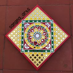 a colorful tile on the side of a building with words above it that read sanggad arts