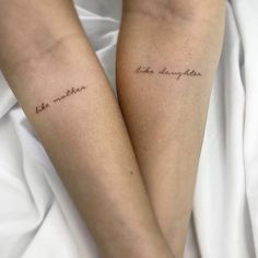 two people with tattoos on their legs that say, the mother and daughter are in cursive handwriting