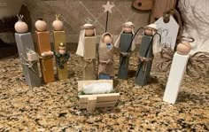 a group of wooden figurines sitting on top of a counter