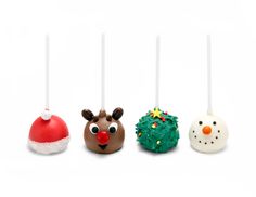 four christmas cake pops with decorations on them